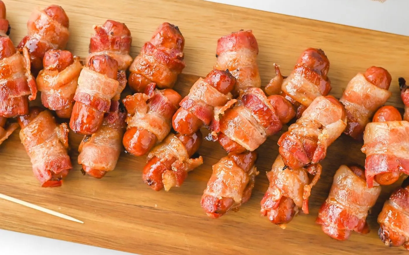 These bacon wrapped smokies are one of those appetizers that never last long. Smoky little sausages get wrapped in bacon and baked with a sweet brown sugar glaze until everything is sticky, crispy, and completely irresistible. With just a handful of ingredients and minimal prep, they’re perfect for game day, parties, or anytime you need an easy crowd-pleaser.