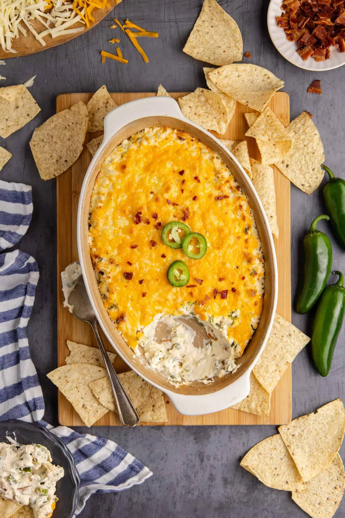 This baked jalapeño popper dip is rich, creamy, and loaded with melty cheese and crispy bacon. Fresh jalapeños add that classic popper heat, but without any of the stuffing or frying. Warm, scoopable, and always a crowd-pleaser, it’s the kind of hot dip that disappears fast at parties and game day gatherings.