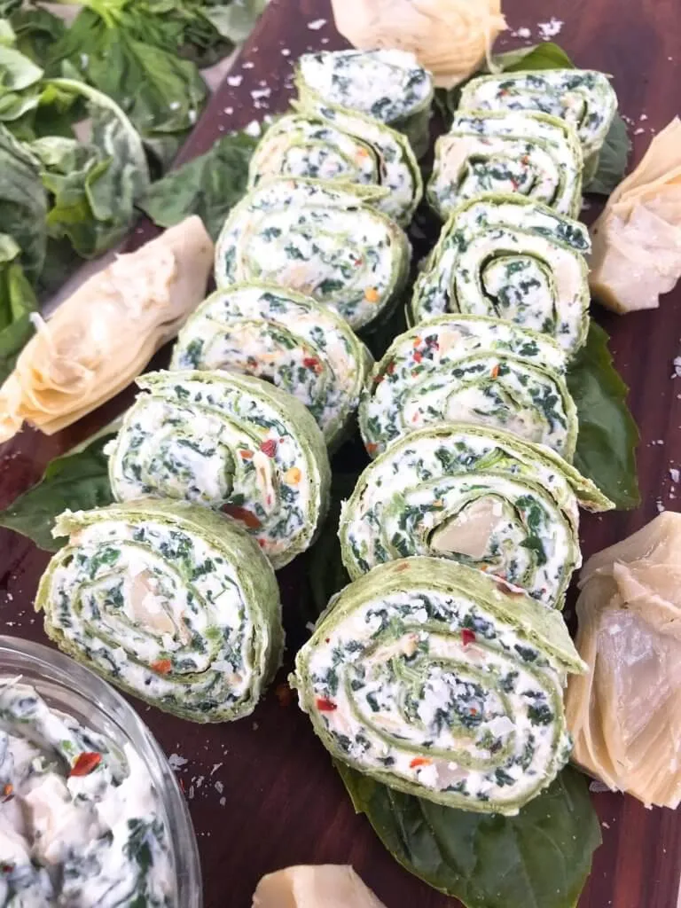 These spinach artichoke pinwheels take all the creamy, cheesy flavors of the classic dip and turn them into an easy, handheld appetizer. Everything gets spread onto a tortilla, rolled up, and sliced into bite-sized rounds that are perfect for parties, game day, or quick finger food with zero fuss.