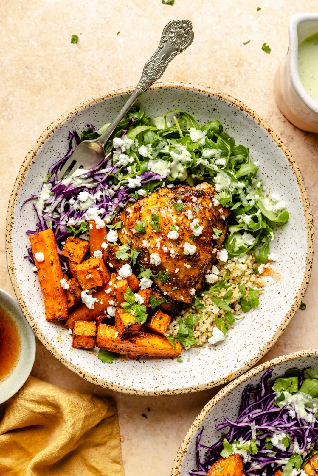 These hot honey chicken bowls are made with sheet pan chicken, a colorful mix of roasted veggies, and hearty quinoa, all finished with a creamy, spicy green feta sauce. They’re bold without being heavy, packed with protein, and easy to prep ahead. A solid choice for meal prep lunches or a fuss-free dinner that still feels exciting.