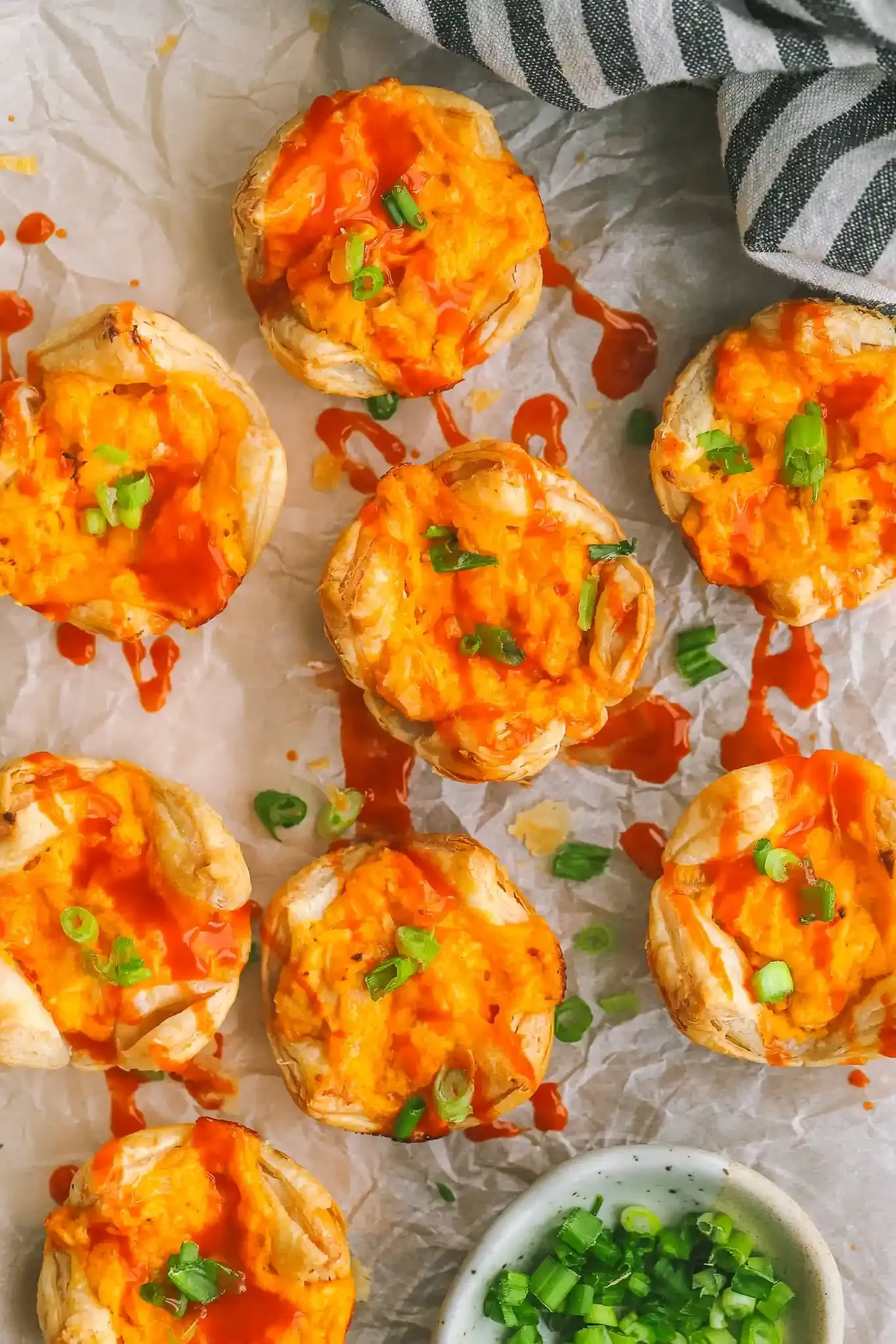 These buffalo chicken puff pastry bites are the perfect game-day appetizer! Cheesy, spicy and crunchy, they're a must-make delicious bite.