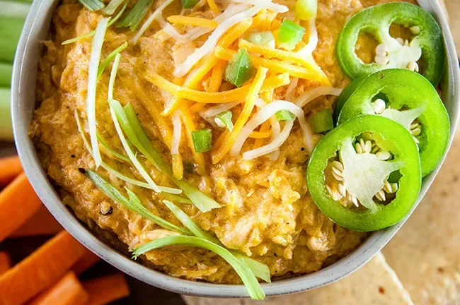 This easy crockpot buffalo chicken dip is cheesy, spicy, and downright addictive! Perfect for game day, parties, or any time you need a crowd-pleasing snack. Just dump, stir, and let the slow cooker do its thing—hello, creamy deliciousness!