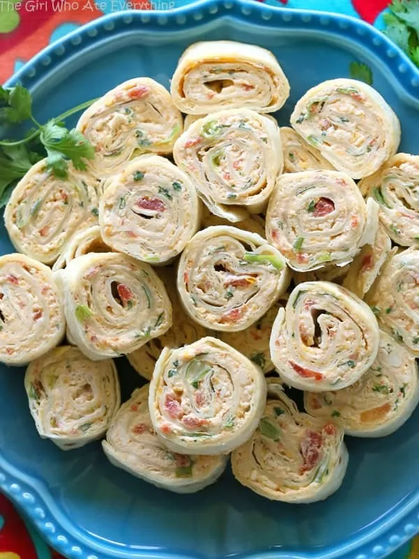 Chicken Enchilada Roll Ups are a great appetizer recipe for parties! Easy to make ahead and easy to serve - they are a guaranteed crowd pleaser whatever the occasion.