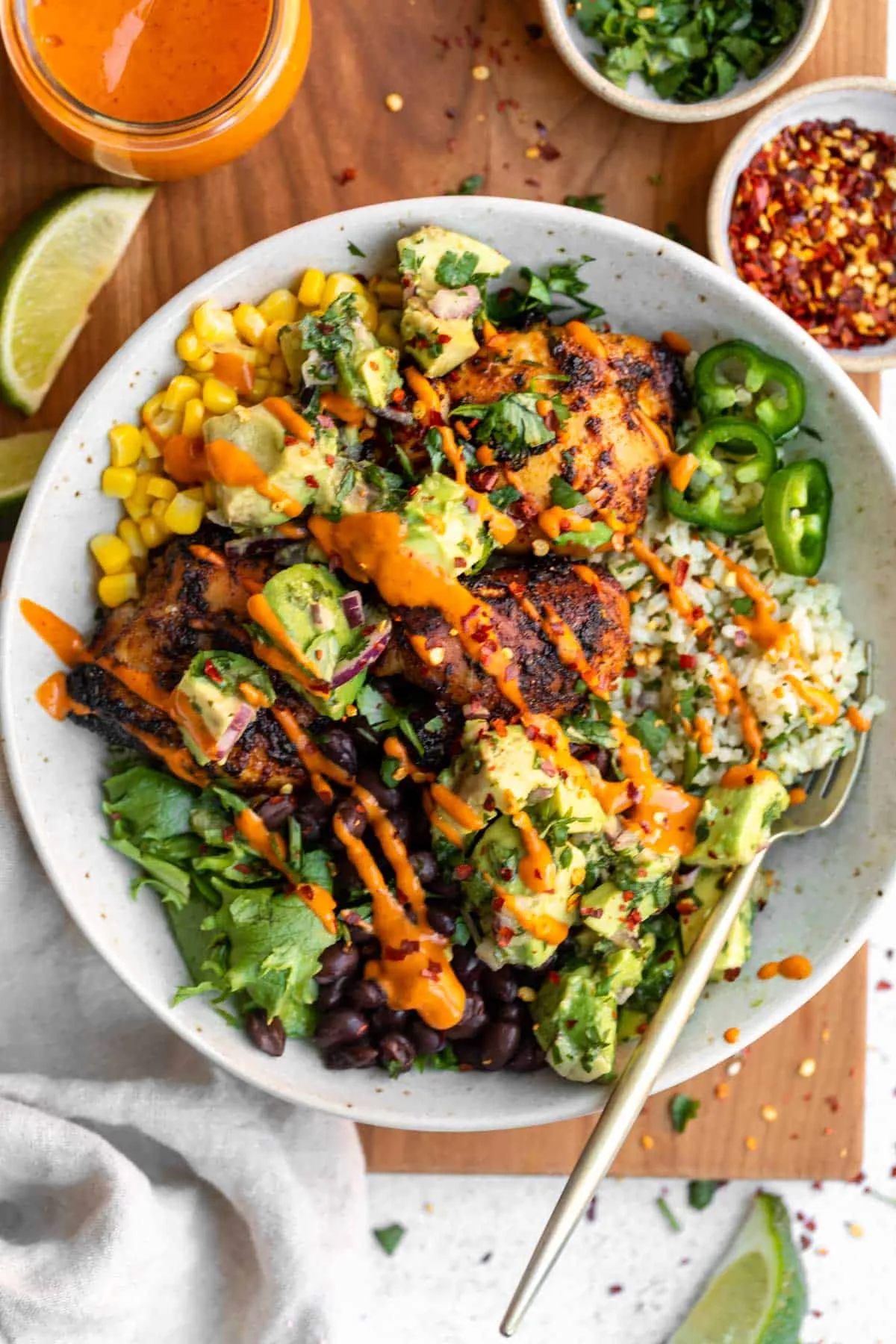 These cilantro lime chicken rice bowls feature juicy marinated chicken, fluffy cilantro lime rice, fresh avocado salsa, and a creamy chipotle-style sauce. They’re bright, flavorful, and perfect for weeknight dinners or easy meal prep.