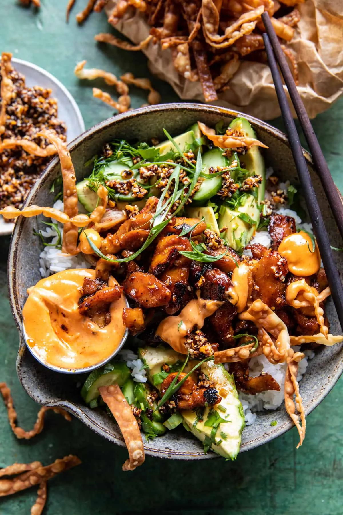 These spicy yum yum chicken rice bowls feature orange-ginger chicken, fluffy rice, and a creamy yum yum-style sauce with plenty of fresh and crunchy toppings. Made on a sheet pan for easy prep, they’re a colorful, family-friendly option for weeknight dinners or casual entertaining.