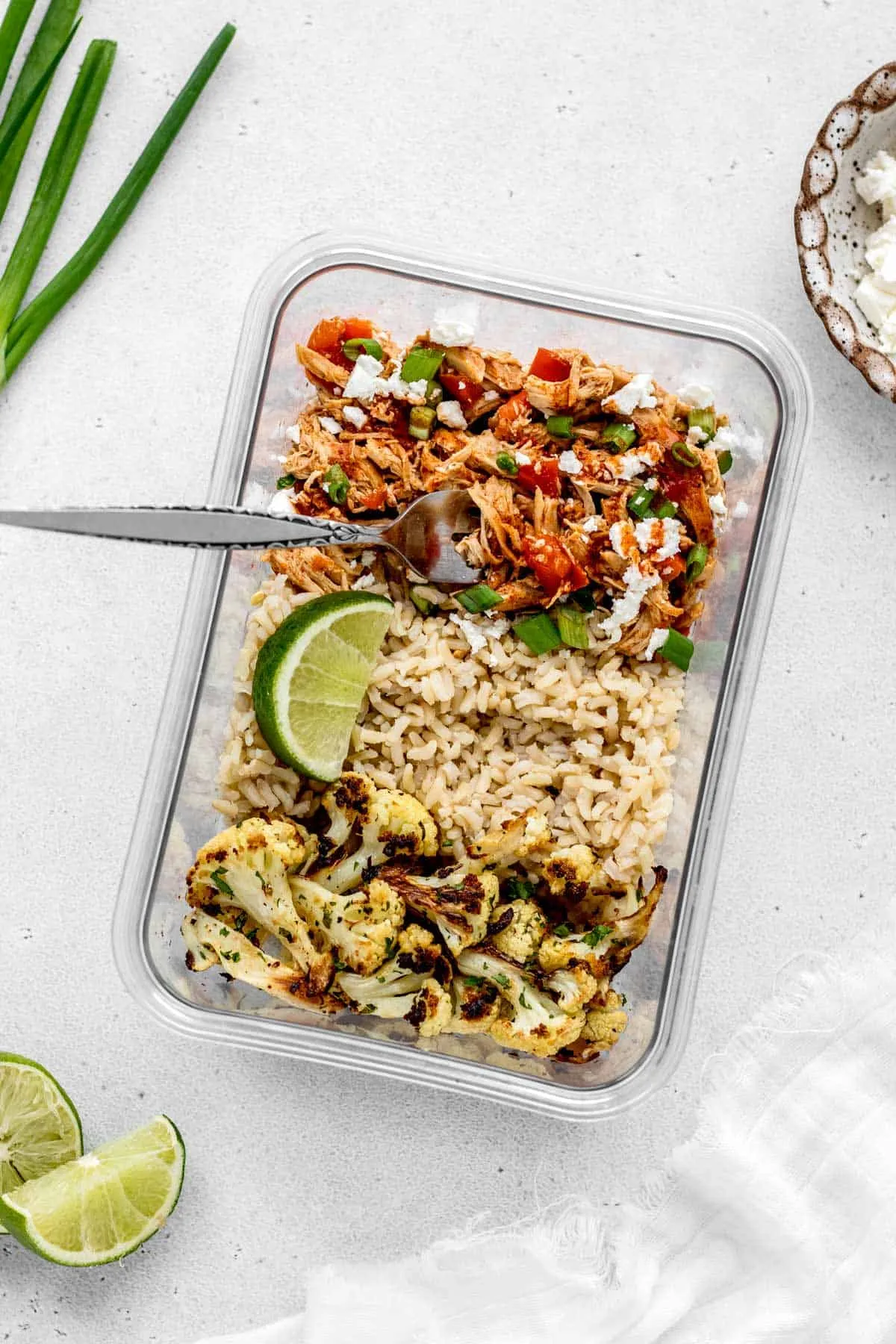 These shredded Buffalo chicken bowls are exactly the kind of meal you want waiting in the fridge when life gets busy. Slow-cooked Buffalo chicken gets piled over fluffy rice and roasted garlic cauliflower for a bowl that’s hearty, spicy, and super satisfying without feeling heavy. It’s one of those make-ahead meals that somehow tastes even better the next day, whether you’re packing it for lunch or throwing together a quick dinner after a long day.