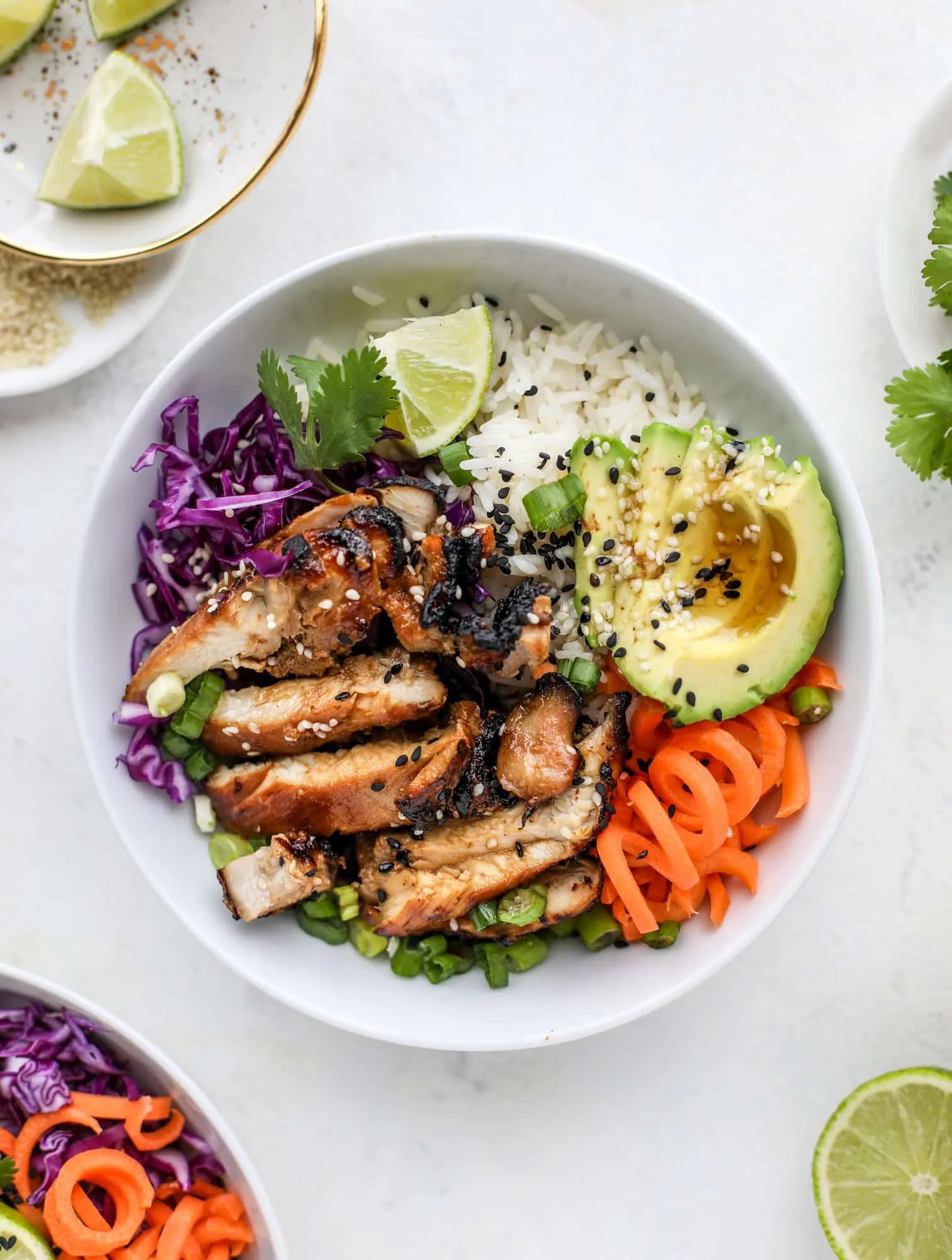 These sesame soy chicken rice bowls are colorful, full of bold flavor, and easy to make. With saucy chicken, fluffy rice, and fresh toppings, they’re a great choice for weeknight dinners or make-ahead lunches you can enjoy all week long.