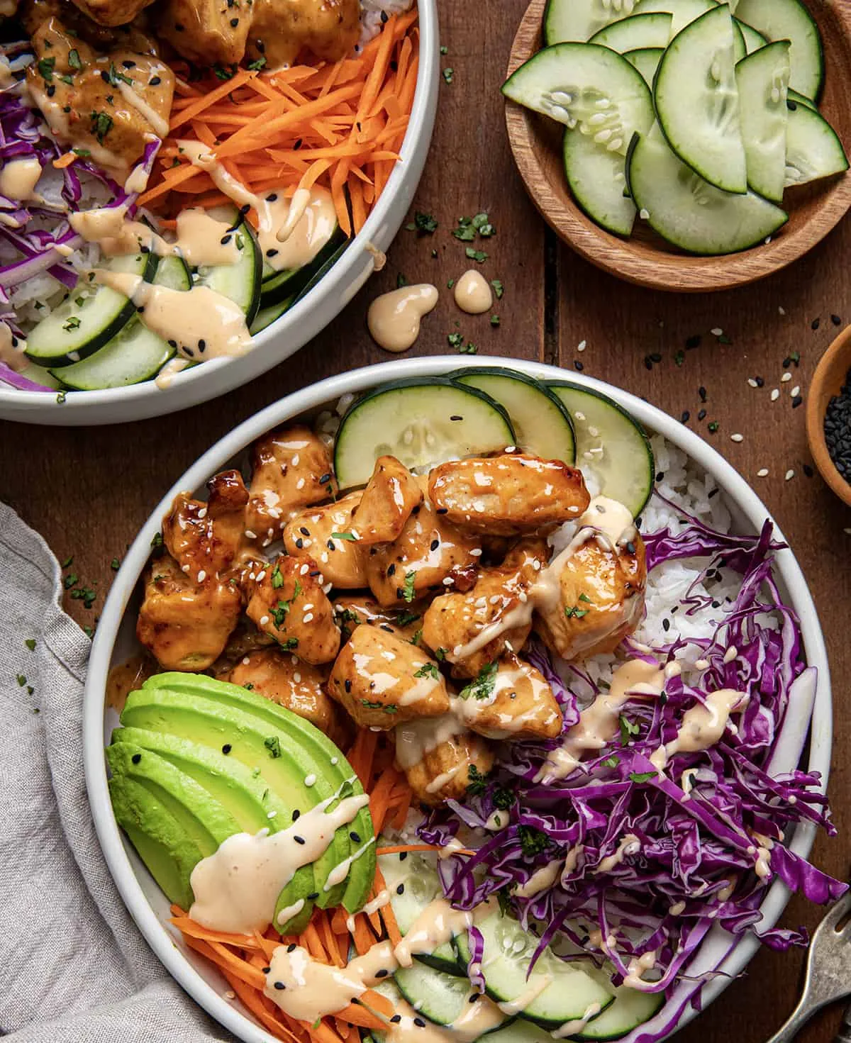 These chicken bowls feature tender, seasoned chicken tossed in a creamy, spicy Bang Bang sauce and served over rice with crisp vegetables. Finished with avocado, cilantro, and sesame seeds, they hit that perfect balance of rich and fresh. The chicken cooks quickly in the air fryer (with skillet instructions included), making this an easy, flavor-packed option for weeknight dinners or make-ahead lunches.