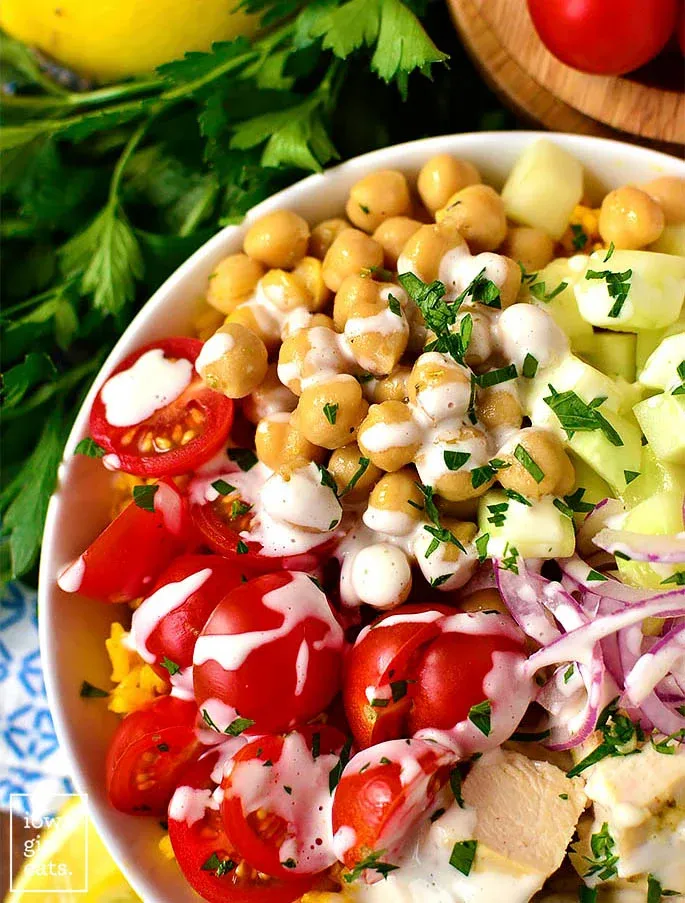 These Mediterranean chicken bowls put a fresh spin on the classic burrito bowl, swapping in Greek-style flavors with seasoned chicken, chickpeas, and vibrant yellow rice. Think Greek salad meets juicy chicken in a bowl that feels colorful, filling, and satisfying without being heavy. An easy at-home option when you’re craving something bold and Mediterranean-inspired but still want a simple, wholesome dinner.