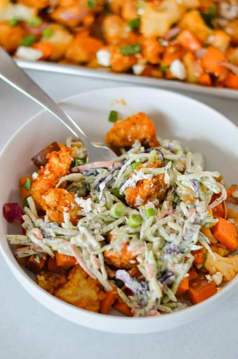 These Buffalo chicken and sweet potato bowls are pure weeknight comfort in a bowl. You get tender sheet-pan chicken and roasted sweet potatoes drizzled with a sticky Buffalo honey sauce, then topped with cool, creamy coleslaw to balance out all that bold flavor. It’s the kind of meal that feels fun and hearty but is still easy enough to throw together on a busy evening—and every bite hits that perfect sweet-spicy-crunchy combo.