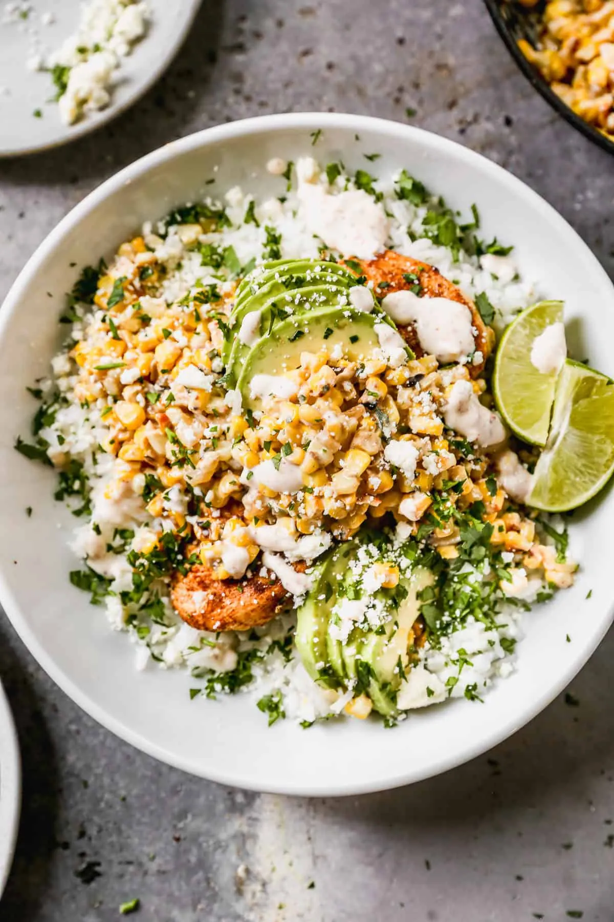 These chicken rice bowls are packed with bold Mexican-inspired flavor, thanks to juicy seasoned chicken, charred corn, and a creamy tajín-lime sauce that pulls everything together. They come together quickly, are easy to customize with your favorite toppings, and make a fresh, satisfying dinner when you want something fun without a lot of fuss.