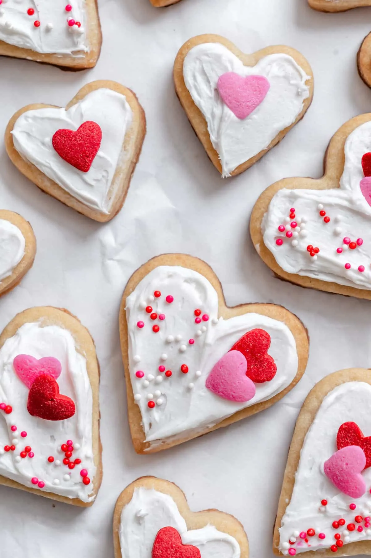 These Valentine’s Day sugar cookies are buttery, soft, and perfect for decorating. Finished with simple frosting and fun heart toppings, they work just as well for gifting as they do for an easy holiday dessert. Best of all, this recipe comes together quickly, making it ideal when you want something cute without a lot of fuss.