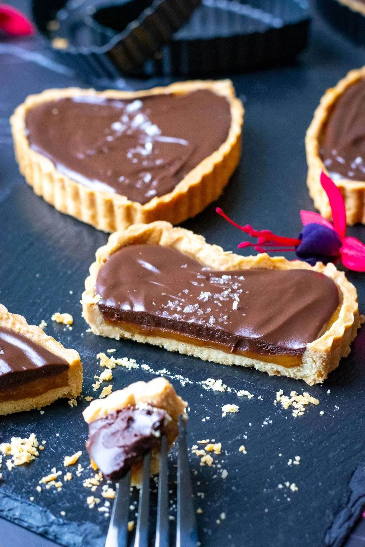 These caramel tartlets are the kind of dessert that feels a little dangerous — in the best way. Sweet, golden caramel and rich dark chocolate ganache sit inside a buttery tartlet case that melts in your mouth. Elegant, indulgent, and perfect for Valentine’s Day, they’re the kind of treat you’ll keep sneaking back to long after dessert is over.