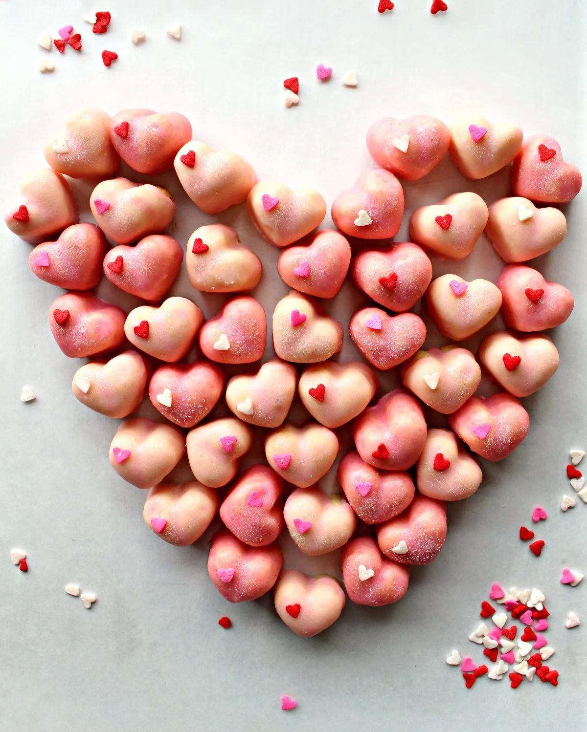 These iced sugar cookie hearts are little bites of love. Sweet, crunchy, and topped with pretty icing, they’re perfect for sharing with anyone you want to treat on Valentine’s Day. Simple, classic, and made for spreading the love.