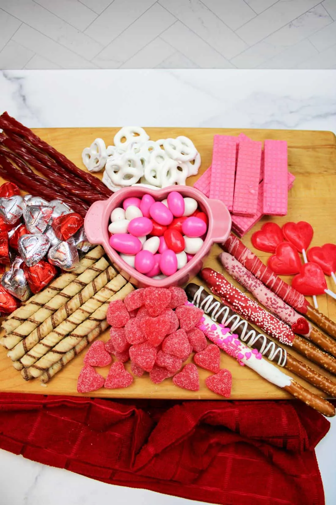 This pink food board is all about fun, color, and easy grabbing, which makes it perfect for a kids’ Valentine’s party or classroom celebration. The vibe is playful and unfussy, with familiar sweets arranged in a way that feels inviting rather than overstyled. It’s the kind of board you can set out and let kids happily pick at while they play, craft, or watch a movie — no instructions required.