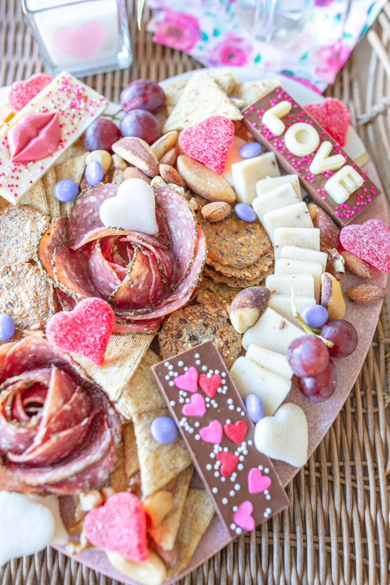 This pink food board has a cozy, intimate vibe that makes it perfect for a Valentine’s date night at home. It leans more savory with just enough sweet touches to keep things playful, striking that balance that feels thoughtful rather than over-the-top. Everything about it feels intentional and relaxed — ideal for lingering, sharing, and turning dinner into an experience instead of a rushed meal.