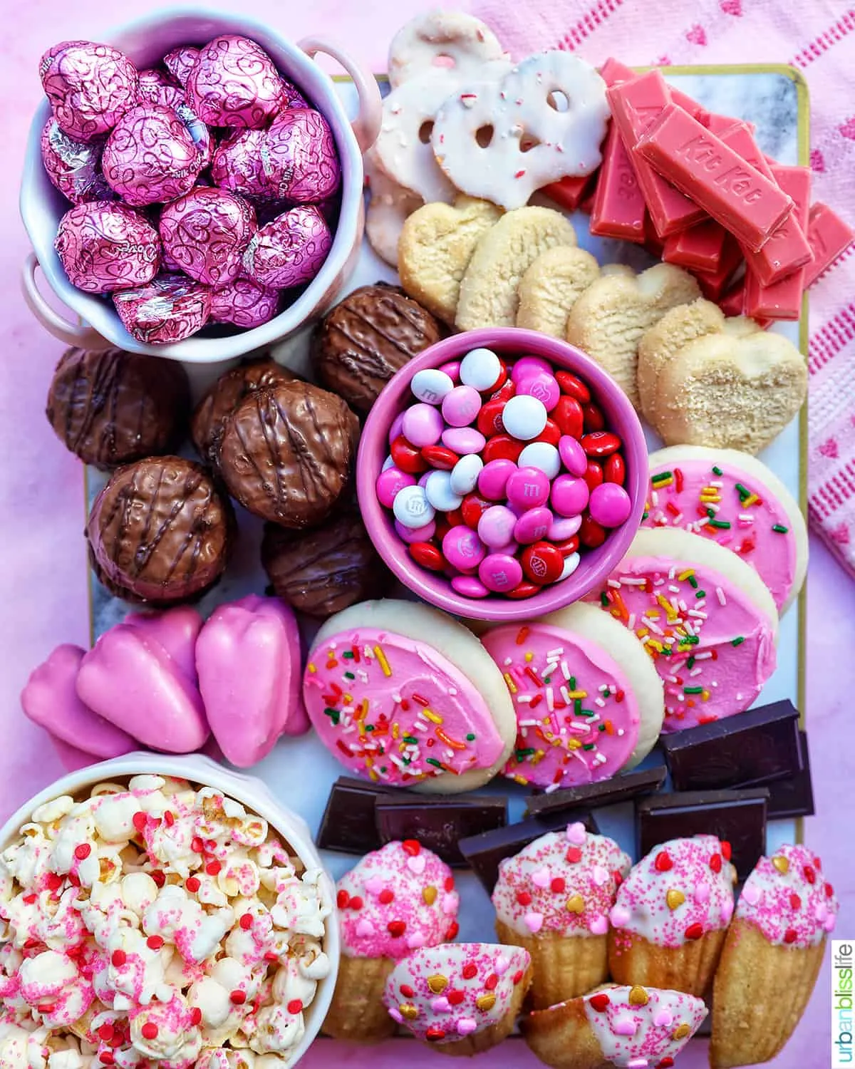 This pink food board is pure fun and sugar-forward, making it perfect for a Valentine’s sleepover or kids’ party where the goal is treats, giggles, and zero formality. The vibe is playful and colorful, with lots of small sweets that feel exciting and easy to share. It’s the kind of board that feels special without being precious — ideal for letting kids (or kids-at-heart) pick, snack, and enjoy every pink bite.