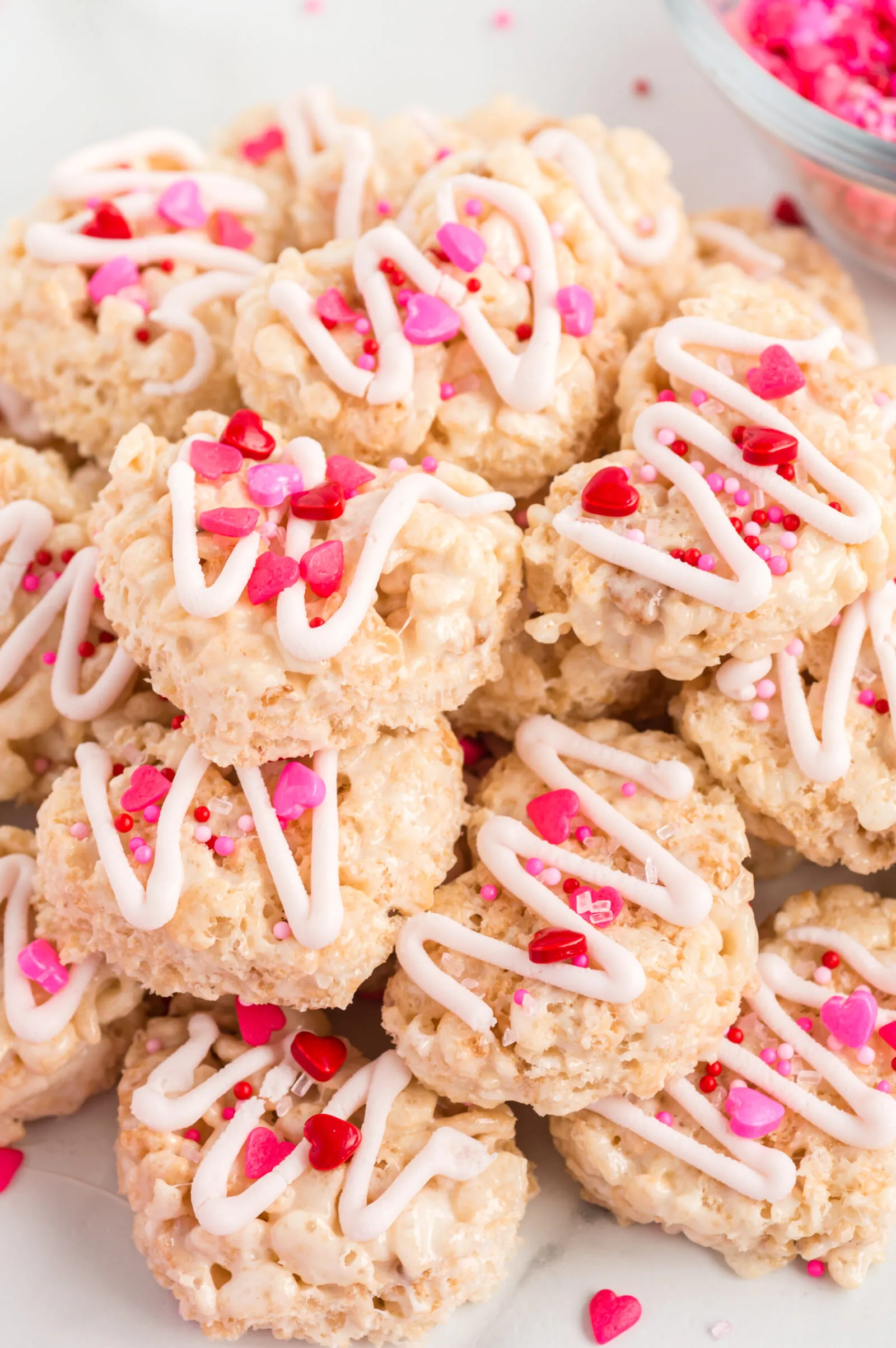 These Valentine’s Rice Krispie treats are soft, chewy, and made for sharing. Finished with a drizzle of white chocolate and festive sprinkles, they’re an easy Valentine’s Day treat that’s fun for kids, classmates, or someone special you want to surprise.