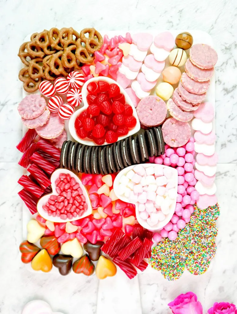 This pink food board is bright, bold, and unapologetically candy-forward, making it a great choice for a Valentine’s party or a festive family gathering. The overall vibe is playful and nostalgic, with lots of familiar treats arranged in a fun, eye-catching way. It’s perfect when you want something colorful and cheerful that instantly says Valentine’s Day and invites everyone to grab a handful of their favorites.