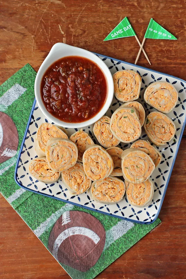 These chicken taco pinwheels are an easy, make-ahead option that works just as well for lunch as it does for parties or game day snacks. A creamy filling made with chicken, cream cheese, Greek yogurt, salsa, taco seasoning, and green onion is rolled into soft tortillas and sliced into bite-sized pieces. They don’t need to be heated, use mostly pantry staples, and are always a crowd-pleasing finger food you can prep ahead and set out when needed.