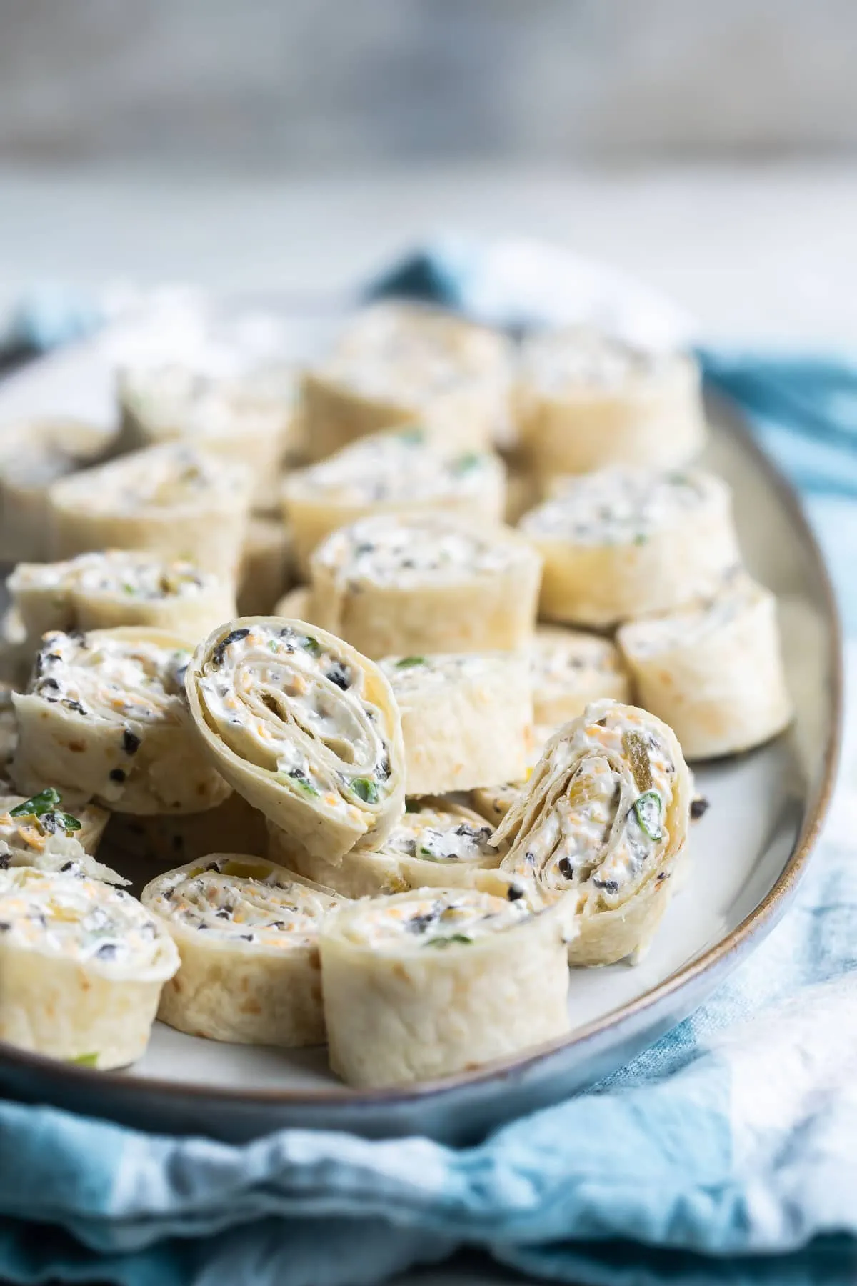 These tortilla roll ups are a zesty, cheesy appetizer that’s perfect for making ahead of time. With a creamy, dip-inspired filling rolled into soft tortillas, they’re easy to slice and serve for parties, potlucks, or casual get-togethers. A simple snack that’s always a hit on appetizer tables.