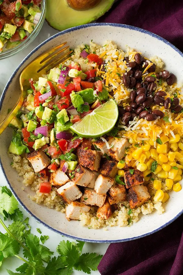 These grilled chicken burrito bowls give you all the bold, cozy Mexican-inspired flavors you love—just without the tortilla. Juicy grilled chicken, colorful toppings, and a hearty base of quinoa make this burrito bowl recipe feel both filling and fresh. It’s a great option when you want a healthy burrito bowl that still tastes like comfort food, and it works just as well for quick dinners as it does for healthy lunches for work.