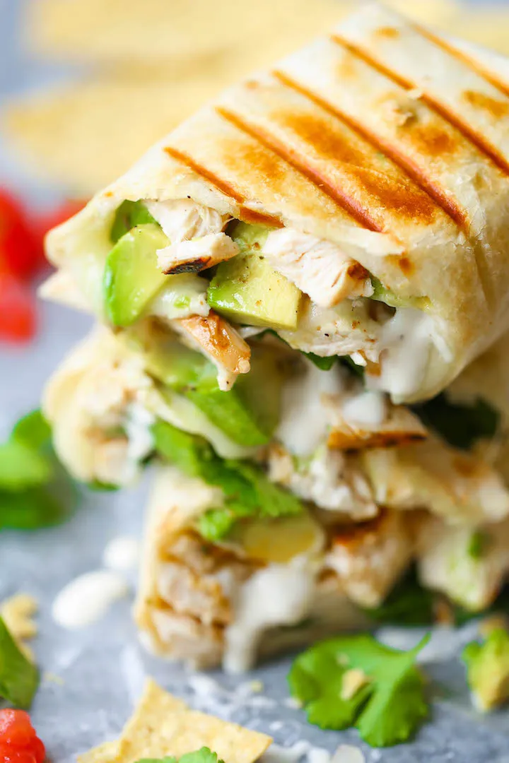 These chicken burritos are all about that street-style comfort food feel, wrapped up in a soft flour tortilla. Juicy chicken is paired with plenty of avocado and a drizzle of creamy ranch dressing for a rich, satisfying bite that feels indulgent without going overboard. An easy, crave-worthy burrito option when you want something familiar, filling, and full of flavor.