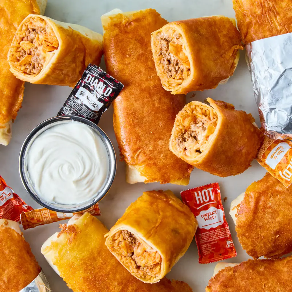 This burrito is what happens when comfort food goes all in. Inspired by the cult-favorite from Taco Bell, it’s stuffed with Spanish rice, seasoned beef, crunchy tortilla chips, sour cream, and nacho cheese, all wrapped in a soft flour tortilla and pan-fried in a layer of melty cheese. It’s rich, filling, and absolutely over the top—in the best way—and easy to recreate at home when the craving hits and you’re not leaving the couch.