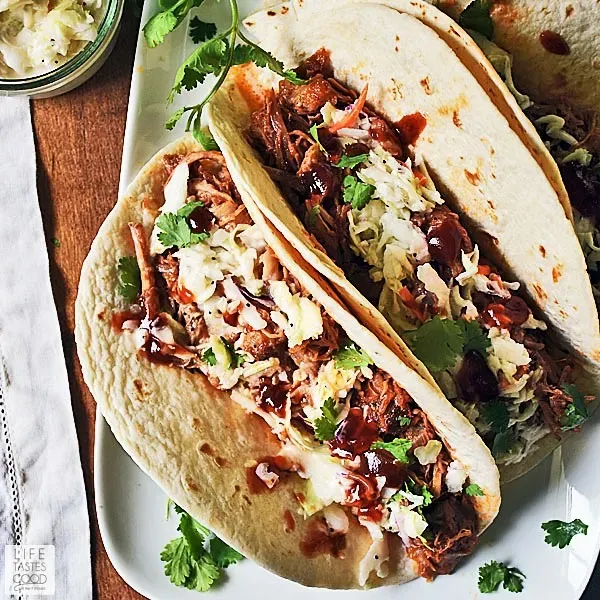 These BBQ pulled pork tacos are an easy way to turn leftover pulled pork into a quick, no-stress dinner. Warm, soft flour tortillas are filled with saucy pork and topped with crunchy coleslaw and fresh cilantro for a satisfying mix of flavors and textures. A great option for Taco Tuesday or any night when you want something comforting that comes together fast.