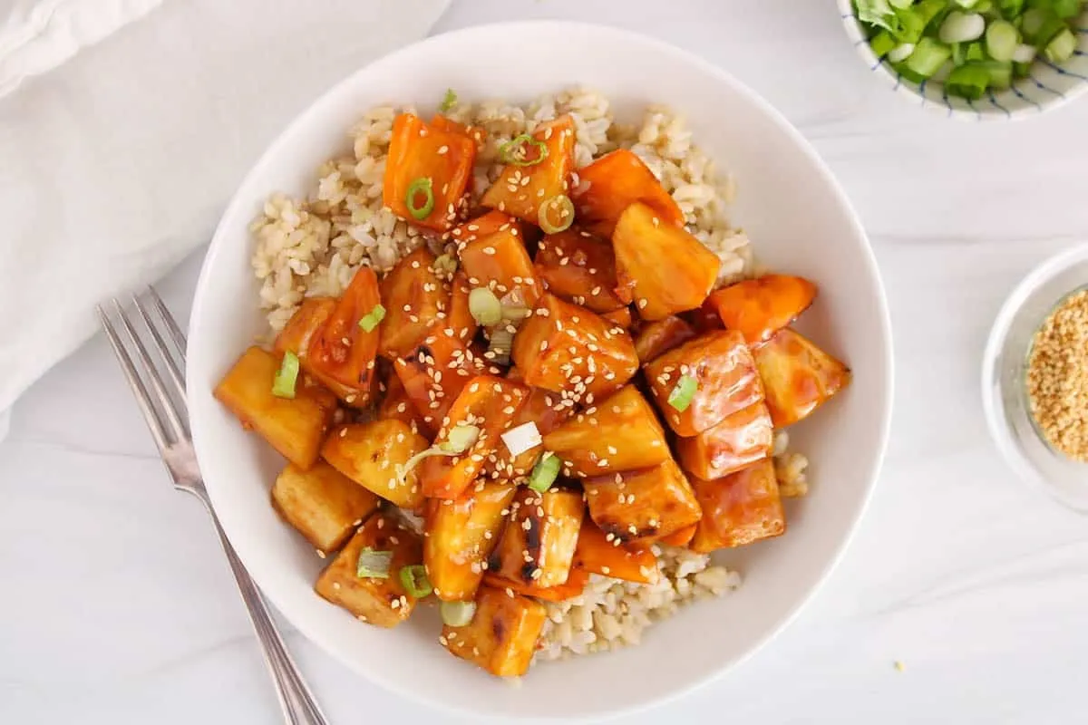 This sweet and sour pineapple tofu is a better-than-takeout dinner that comes together in under 30 minutes. Crispy tofu is tossed with juicy pineapple in a bold, tangy stir-fry sauce for a meal that’s flavorful, satisfying, and completely plant-based. An easy weeknight option that feels fun and comforting without being heavy.