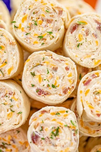 These crack chicken pinwheels are loaded with cream cheese, tender chicken, cheddar, crispy bacon, and ranch, all rolled up in soft tortillas and sliced into easy, bite-sized snacks. They’re perfect for tailgating, game day, or make-ahead party food since you can prep them the night before and serve when you’re ready. Rich, savory, and guaranteed to disappear fast.