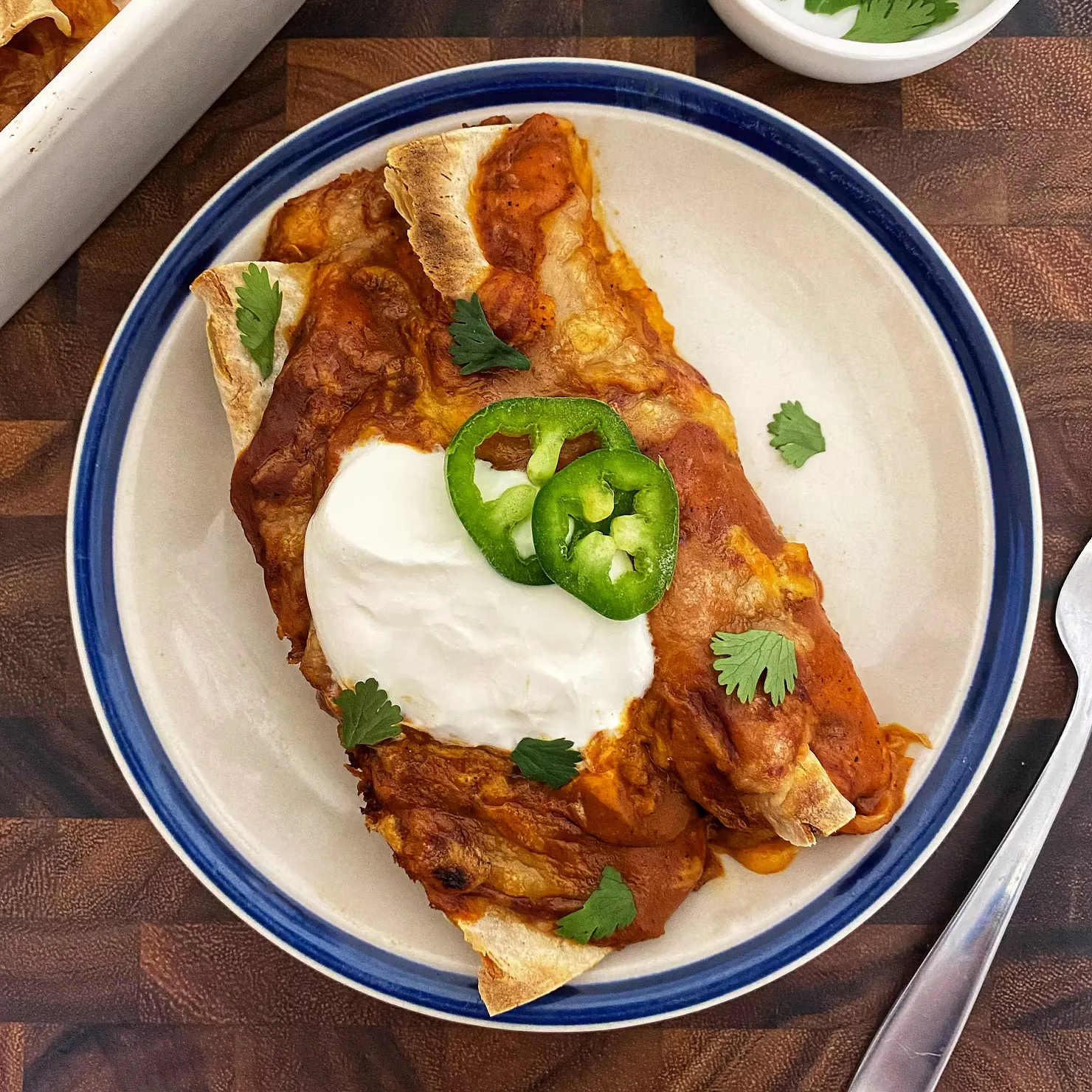 These cabbage enchiladas show just how good a simple, well-made sauce can be. Sautéed cabbage is coated in a rich, streamlined homemade enchilada sauce, rolled into tortillas, and baked under a generous layer of melted cheese for a cozy vegetarian dinner. The sauce strikes a great middle ground — flavorful and made from scratch without being fussy — making this a satisfying, no-overcomplicated take on a Tex-Mex classic.