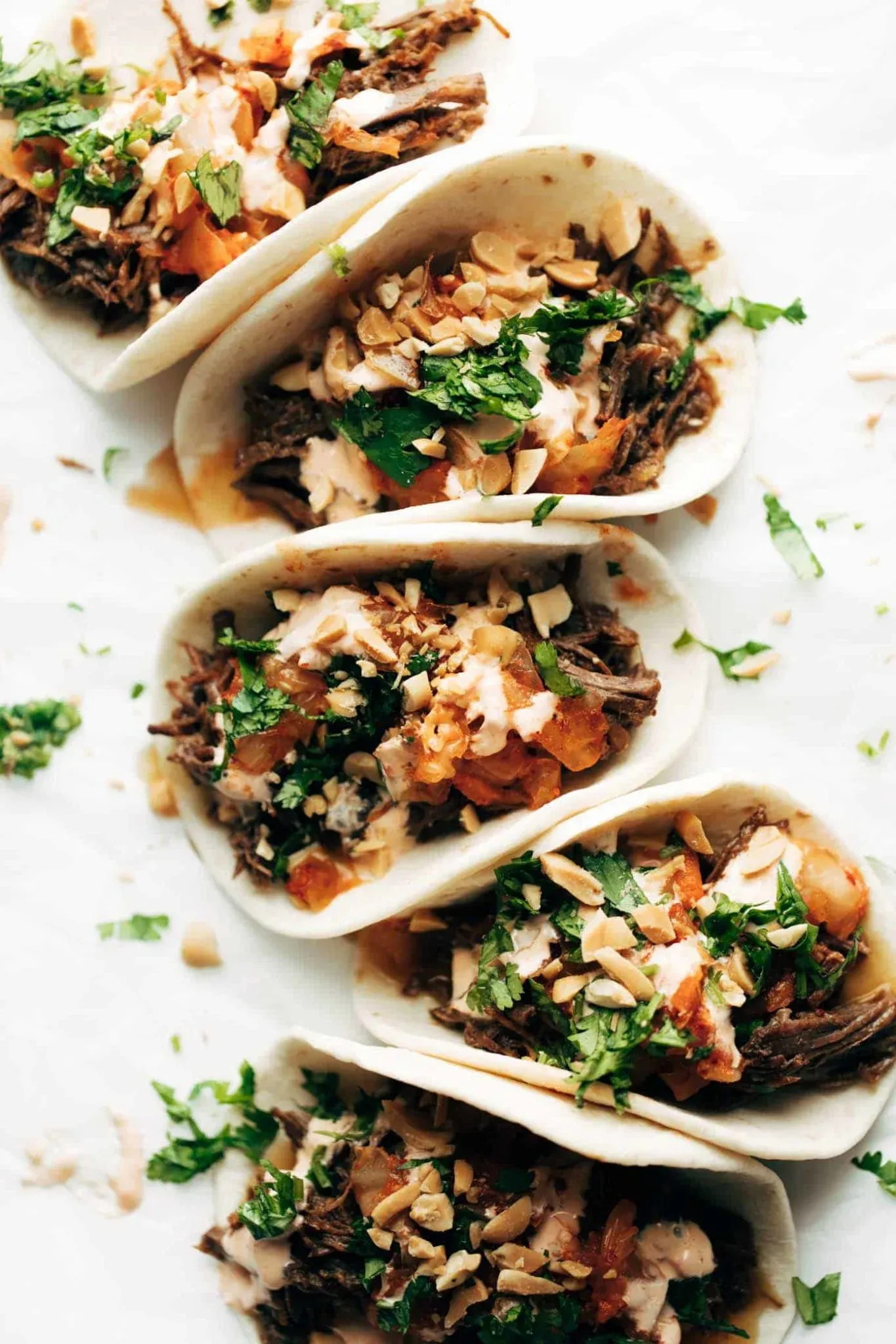 These soft tacos are all about big, bold flavor. Tender, garlicky Korean-style beef is tucked into warm flour tortillas and topped with spicy kimchi, fresh cilantro, chopped peanuts, and a drizzle of creamy spicy mayo. The mix of savory, spicy, and crunchy makes these tacos feel straight out of a food truck, while the Instant Pot keeps them easy enough for a weeknight dinner. A standout option when you want soft taco recipes that feel a little different but still totally comforting.