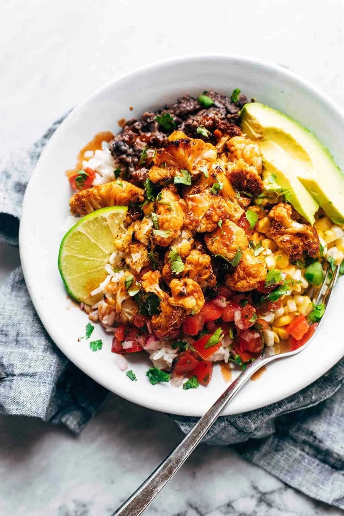 These spicy fajita cauliflower rice bowls are bright, colorful, and seriously satisfying, even though they’re loaded with veggies. They’ve got that hearty, stick-to-your-ribs feeling you want from a burrito bowl, just with a lighter, fresher twist. Instead of traditional rice, everything is piled onto fluffy cauliflower rice, which soaks up all the fajita spices and keeps the bowl feeling filling without being heavy. It’s the kind of meal that wins over even the “I don’t eat healthy food” crowd. 