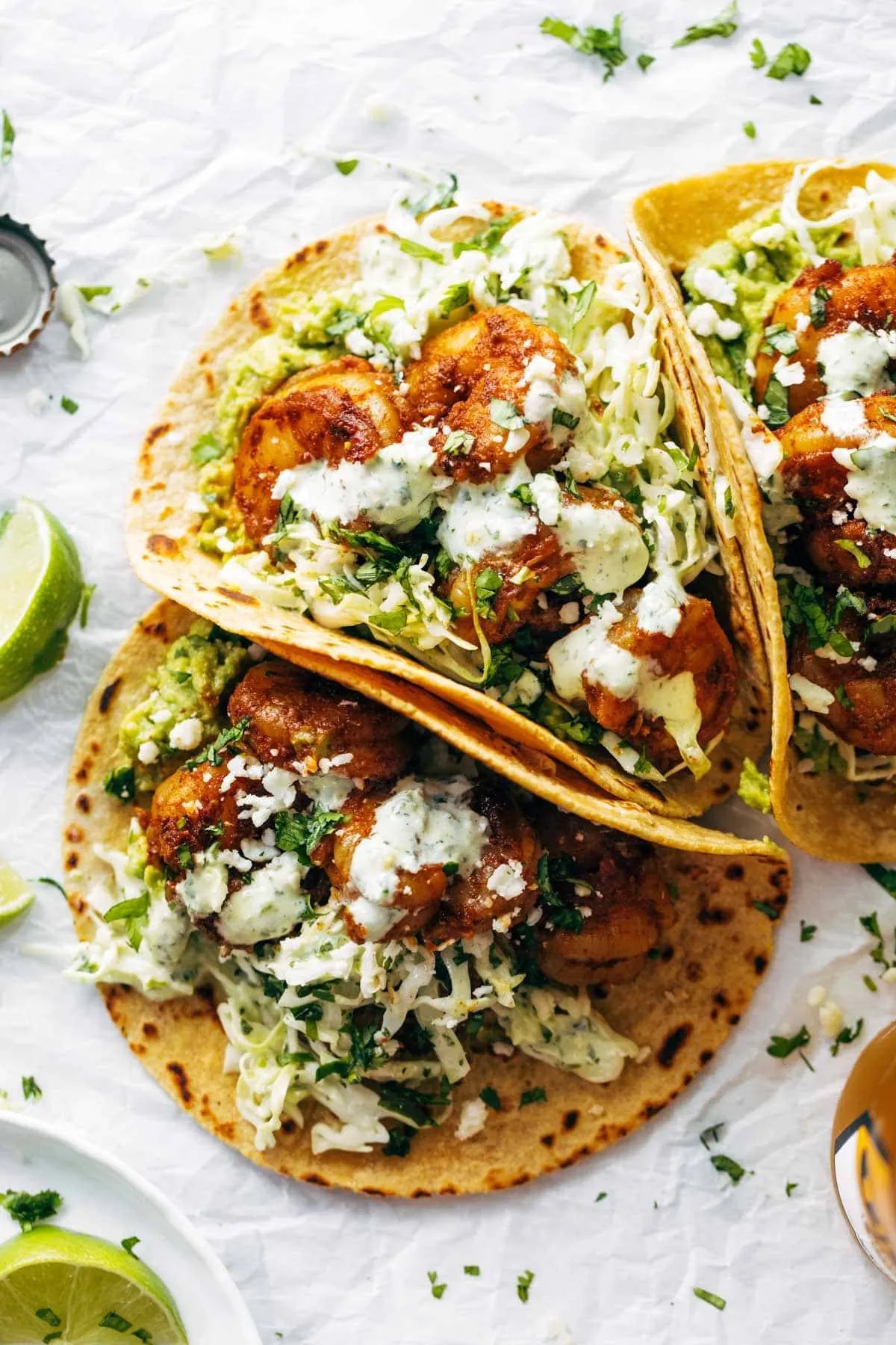 These soft shrimp tacos are loaded with bold flavor, featuring spicy shrimp, creamy avocado, and a garlicky cilantro lime slaw. They’re fresh, vibrant, and satisfying, making them a standout option for taco night when you want something a little lighter but still packed with flavor.