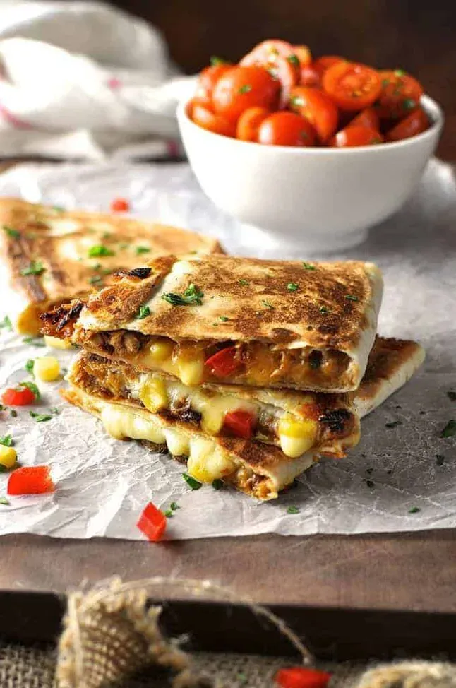 These pulled pork carnitas quesadillas are rich, cheesy, and full of flavor, with caramelized onions adding a simple but delicious upgrade. Made with soft flour tortillas and a generous but not overstuffed filling, they crisp up beautifully on the stove and feel extra satisfying without being complicated. A great option for an easy dinner that still feels a little special — especially if you’re using leftover pork or freezer-friendly fillings.