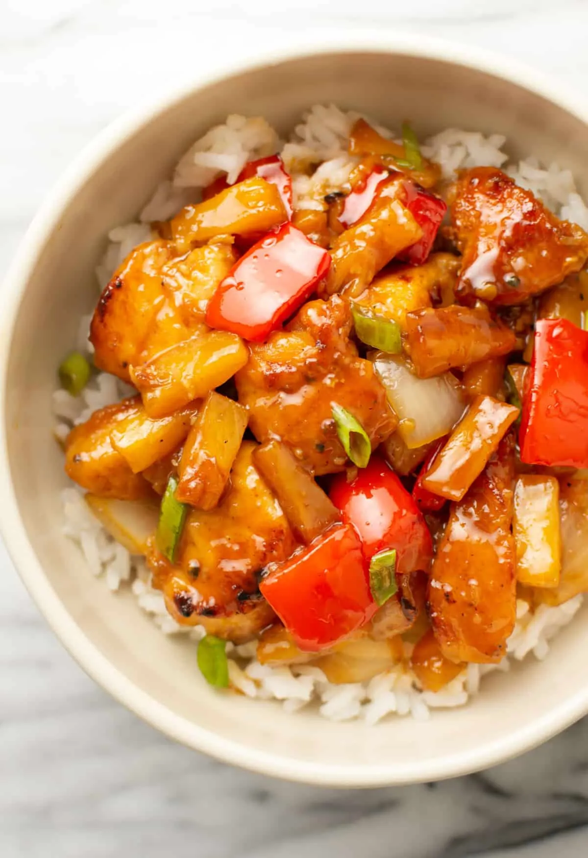 This pineapple chicken stir fry is coated in a sweet-and-tangy sauce that clings to tender chicken, juicy pineapple, and crisp veggies. It’s quick to make, full of flavor, and a budget-friendly option that feels just as satisfying as takeout — without the extra cost.