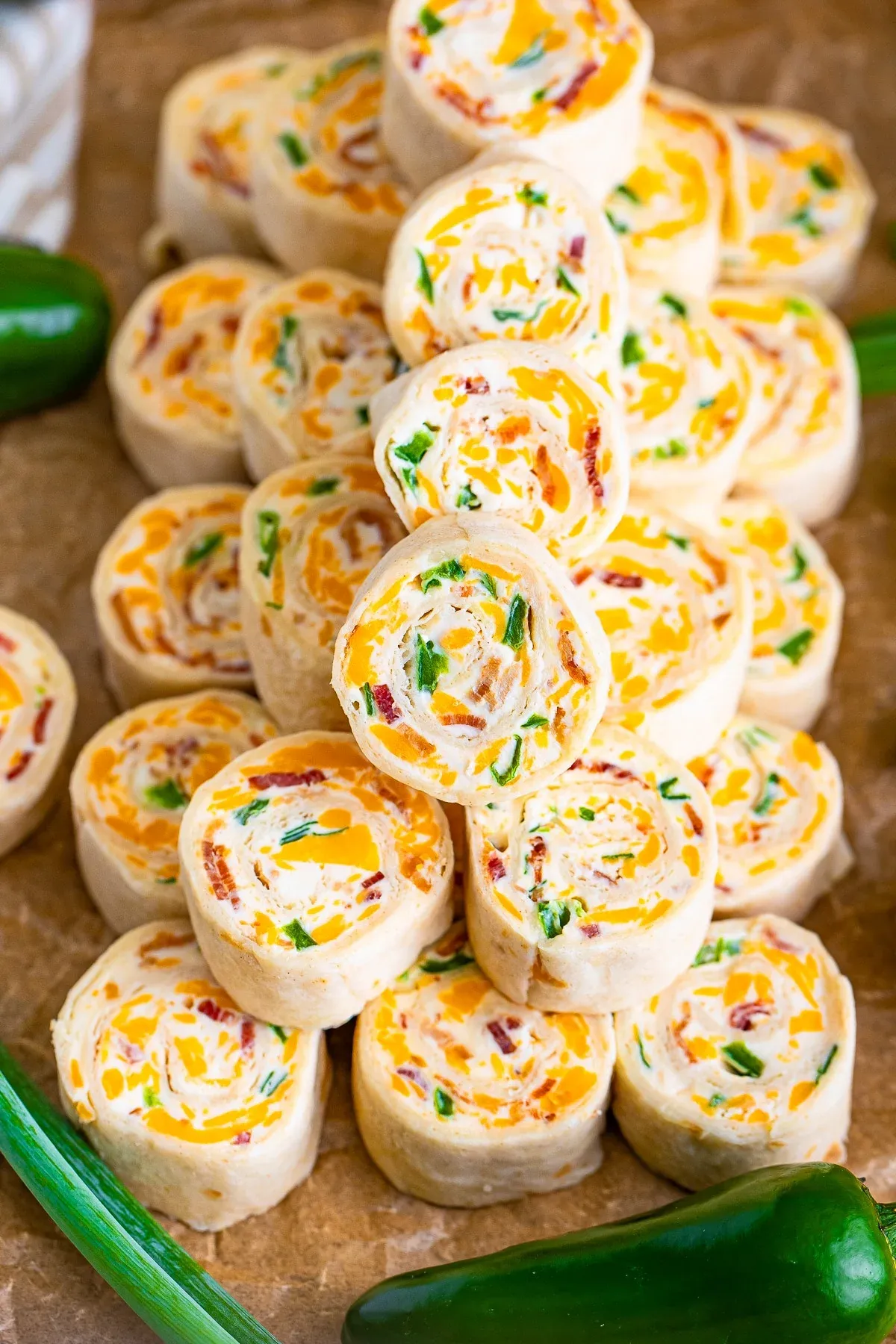 These cream cheese pinwheels are creamy, a little crunchy, and bring just the right amount of heat. Inspired by the flavors of a classic jalapeño popper, they turn that cheesy, spicy combo into an easy, bite-sized pinwheel sandwich. A great choice for parties or snack platters when you want something fun with a little kick.