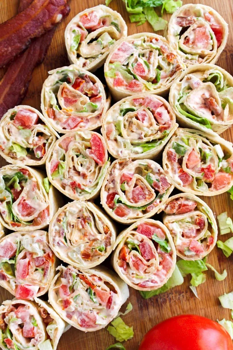 These BLT pinwheels put a fun twist on the classic sandwich, rolling crisp bacon, fresh and sun-dried tomatoes, and romaine lettuce into soft tortillas. They’re easy to make and work just as well for appetizers as they do for quick lunches or snacks. A familiar flavor combo that’s always a hit on pinwheel platters.
