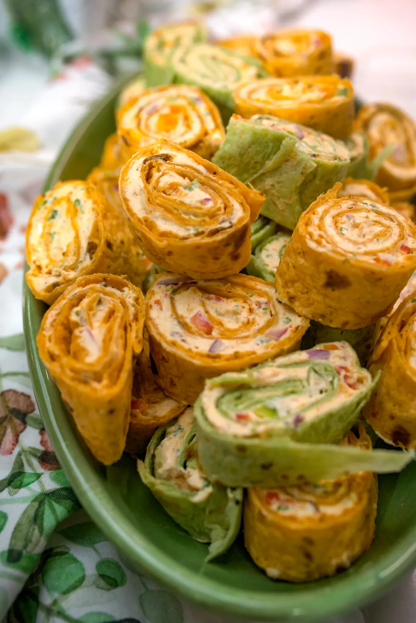 These tortilla pinwheels are a quick, no-cook appetizer that’s perfect for holidays, potlucks, or game night. They come together in minutes with a creamy, flavorful filling made with fresh veggies, herbs, and taco seasoning, then get rolled up in colorful tortillas for extra visual appeal. Easy to make, easy to serve, and always a crowd favorite on party platters.