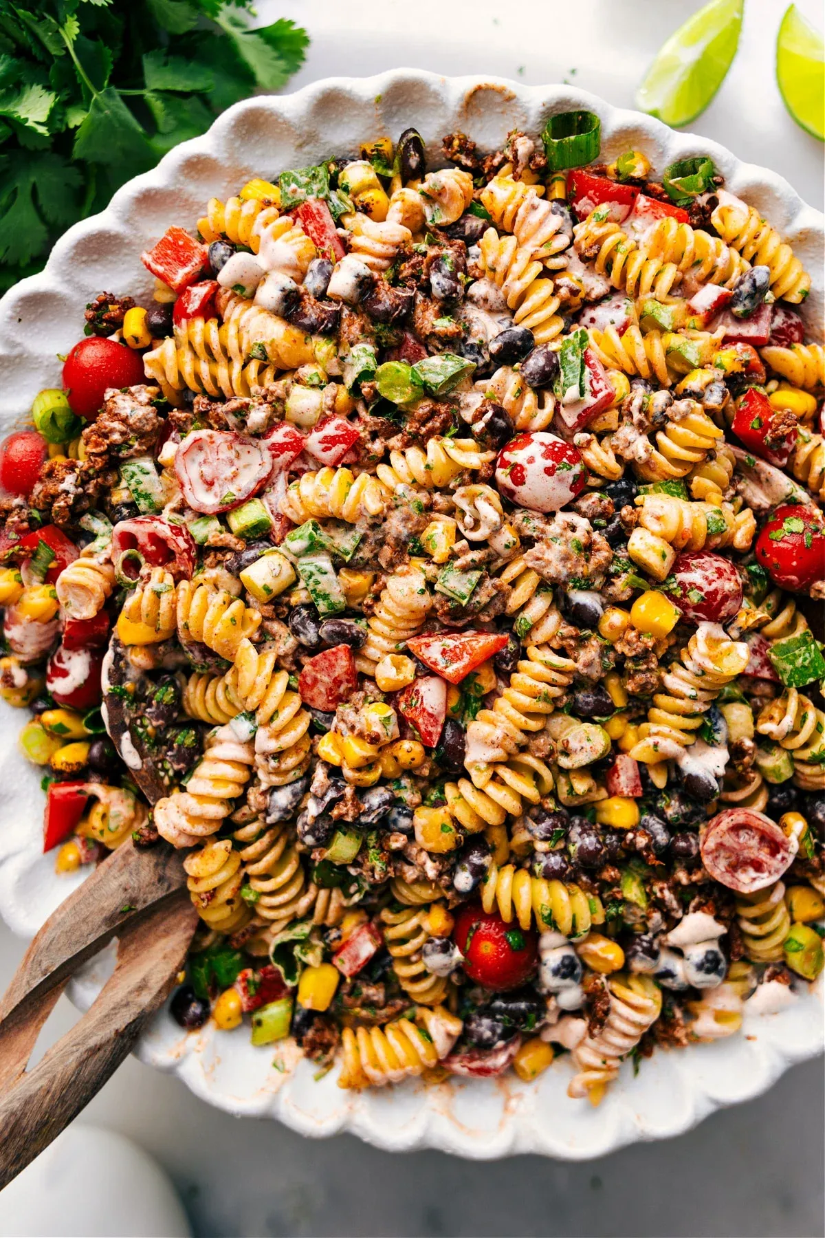 This taco pasta salad combines seasoned meat, crisp vegetables, and a creamy dressing into one hearty, flavor-packed dish. It’s perfect for potlucks, family dinners, or anytime you want something fun and filling in pasta salad form.