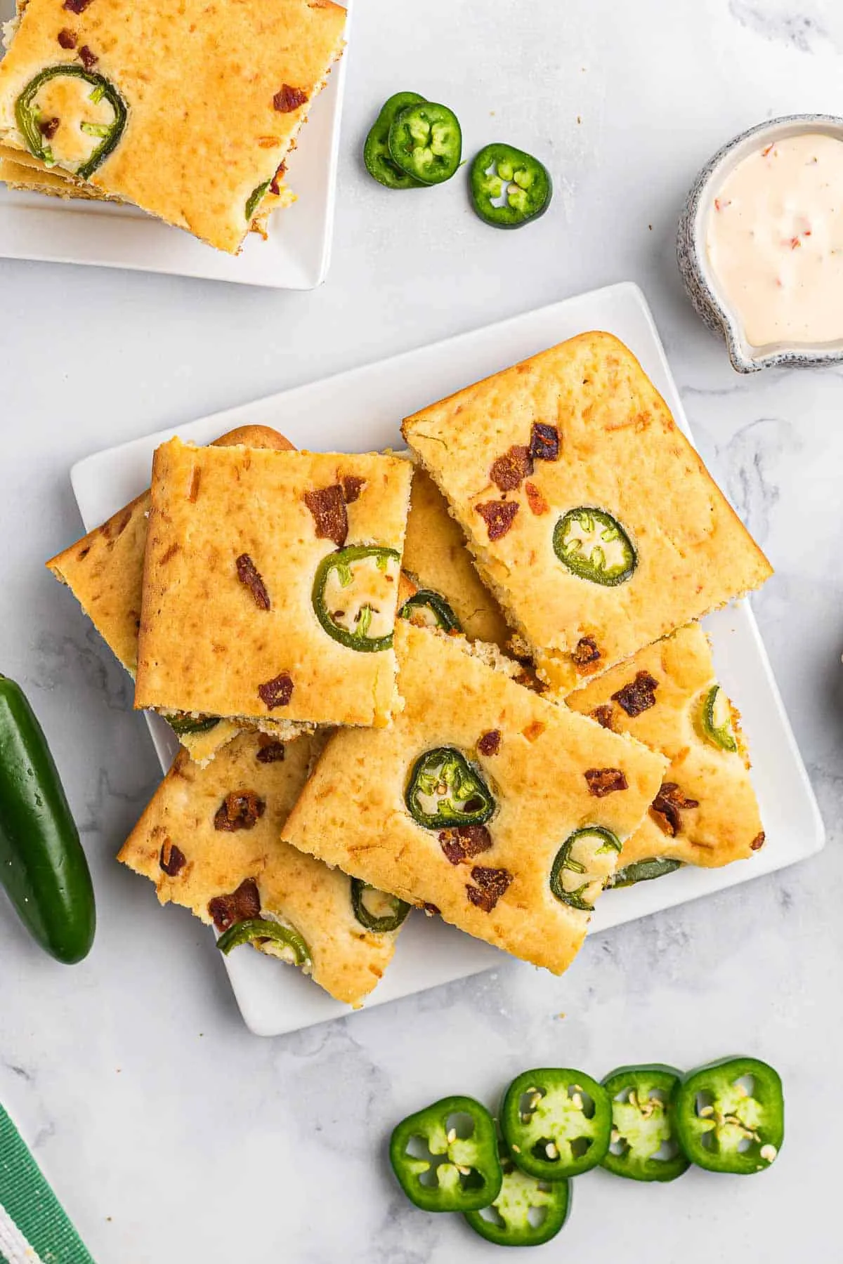 This bacon sheet pan pancake recipe puts a savory spin on a breakfast favorite. With crispy bacon, melty cheddar, a little jalapeño heat, and just a touch of brown sugar, it hits that perfect salty-sweet balance. Baked all in one pan, it’s an easy brunch option when you want something a little different without extra effort.