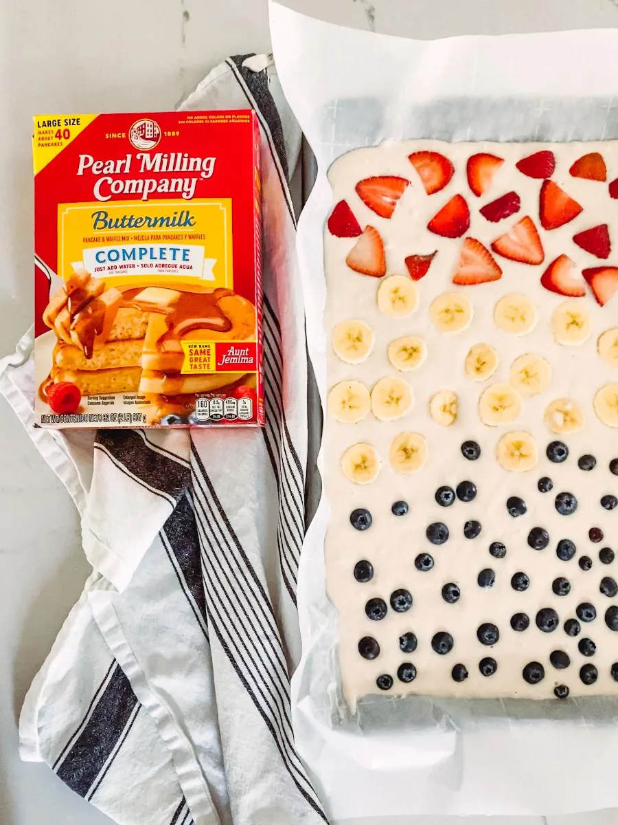 You don't even need to make pancake mix from scratch! You can keep things simple with plain pancakes, or let everyone customize their section with favorite toppings. Banana slices, strawberries, and blueberries press right into the batter, then the whole pan goes into the oven for an easy, no-flip breakfast everyone can agree on.