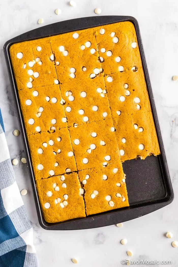 These pumpkin sheet pan pancakes are a fun fall twist on classic pancakes. Soft, cozy pumpkin flavor meets sweet white chocolate chips, all baked together in one pan for an easy, no-flip breakfast. Once the batter is in the pan, you can sprinkle on as many chips as your sweet tooth wants and let the oven do the rest.