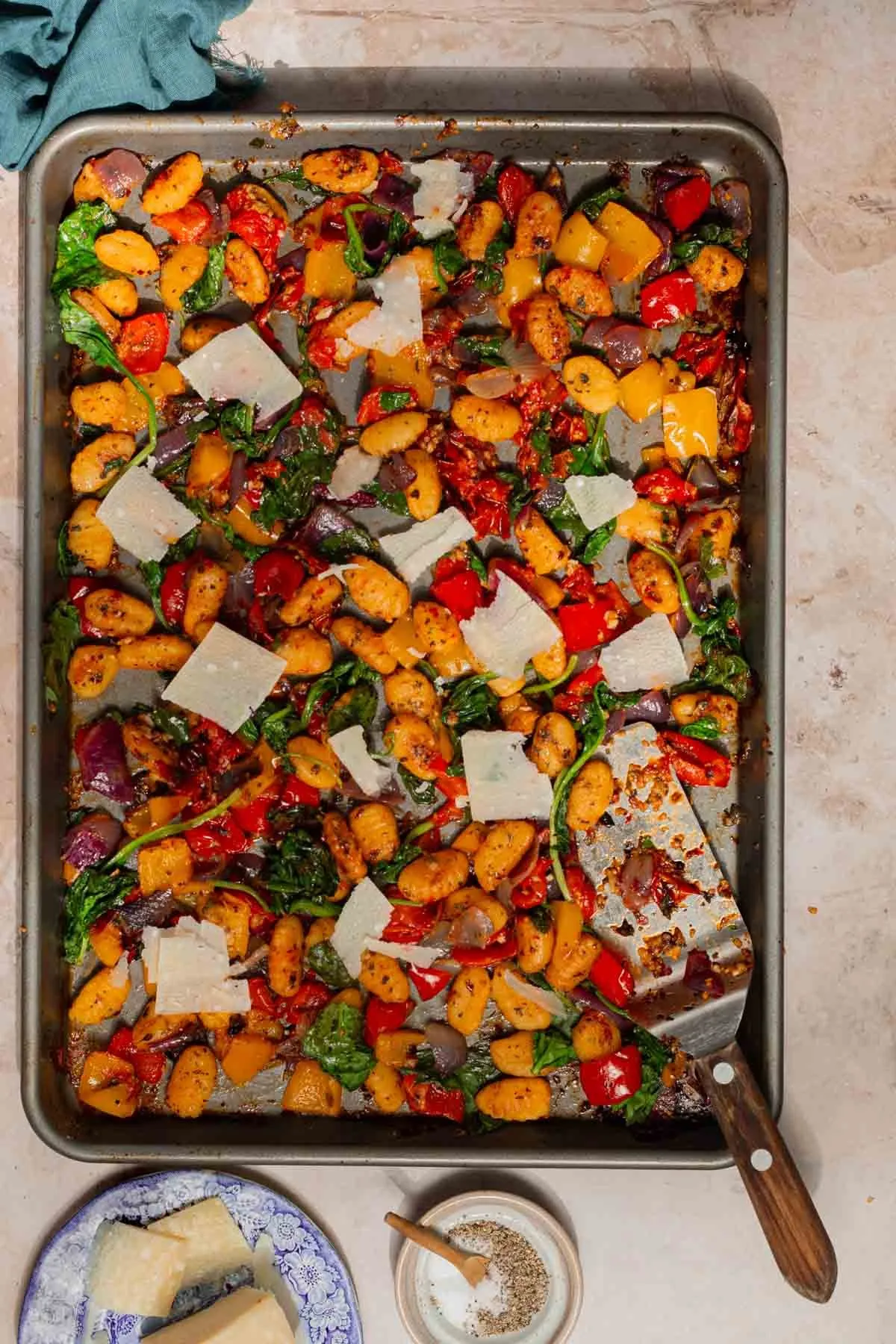This sheet pan gnocchi with roasted vegetables is colorful, comforting, and wonderfully simple. Using shelf-stable gnocchi keeps things easy — just toss it on a pan with bell peppers, onion, cherry tomatoes, and herbs, then roast until everything is tender and golden. A handful of spinach stirred in at the end adds an extra veggie boost, and a sprinkle of parmesan finishes it off (totally optional). It’s a flexible, vegetarian dinner that’s easy to make vegan and perfect for busy weeknights.