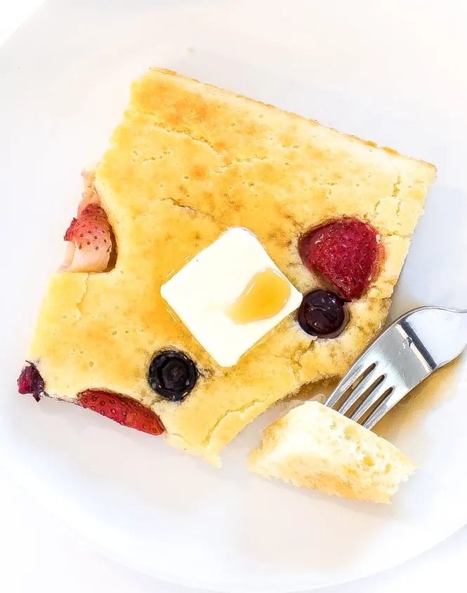 These sheet pan pancakes are ridiculously easy and perfect for feeding a crowd. With just about 20 minutes of prep, the oven does all the work — no flipping required. Studded with strawberries and blueberries, they bake up fluffy, golden, and seriously delicious, making breakfast (or brunch) feel effortless.
