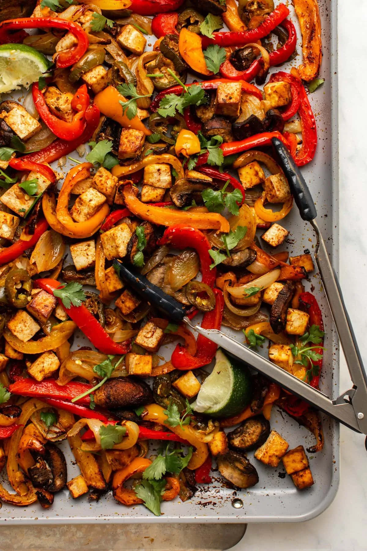 These vegan sheet pan fajitas are bright, fresh, and packed with colorful veggies and crispy tofu. Everything roasts together for a fuss-free Tex-Mex–style meal that’s naturally gluten-free and full of flavor. Perfect for warm-weather dinners or easy lunches when you want something veggie-heavy without spending ages in the kitchen.